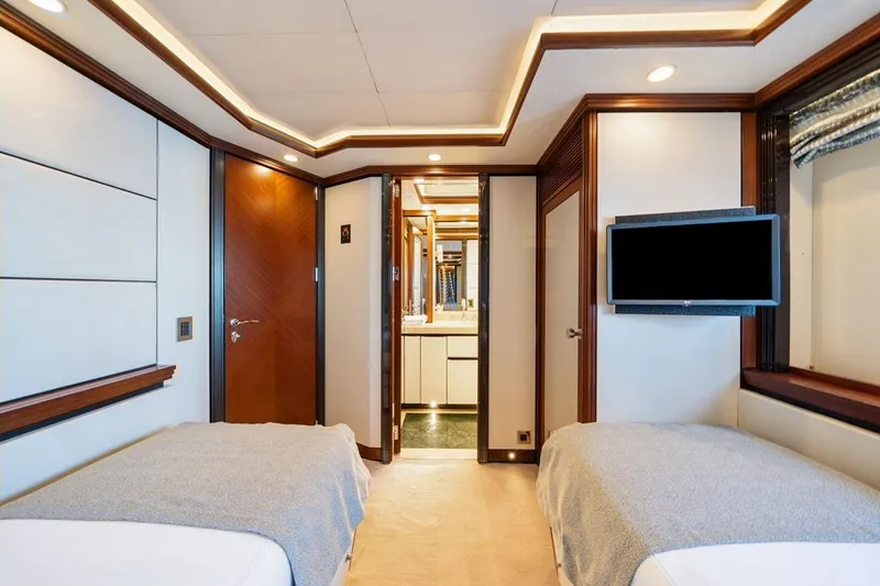 Titian Pearl Yacht Photos Pics Luxurious CRN Magnifica 2001 yacht cabin with twin beds and modern decor.