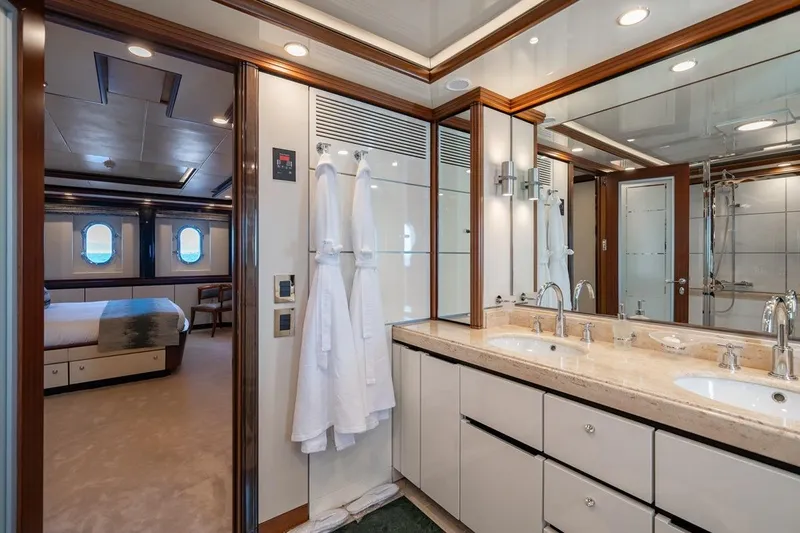 Titian Pearl Yacht Photos Pics Luxurious yacht bathroom with double sinks, elegant fixtures, and adjacent bedroom, CRN Magnifica 2001.
