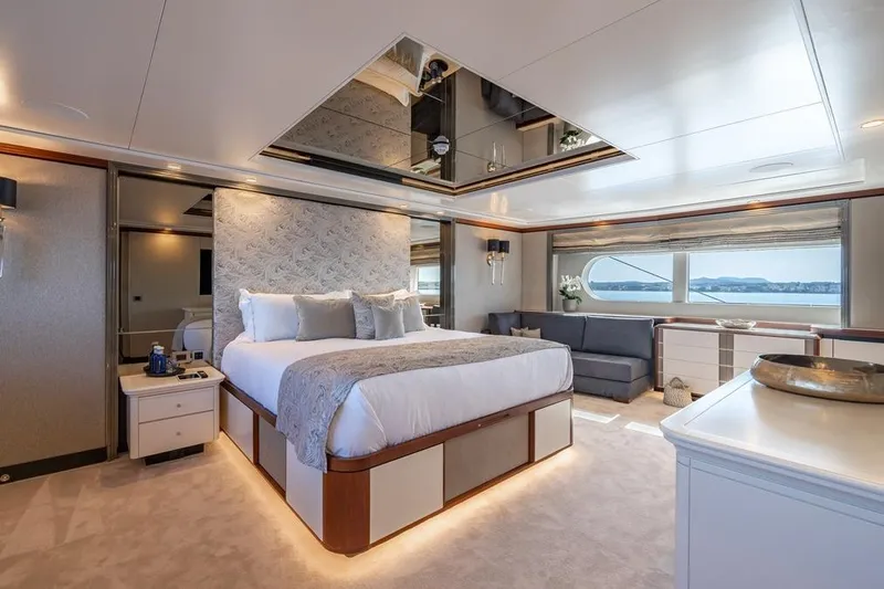 Titian Pearl Yacht Photos Pics Luxurious bedroom interior on 2001 CRN Magnifica yacht with elegant decor and ocean view.