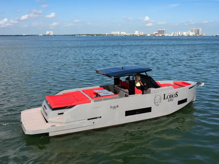 Painkiller Yacht Photos Pics 2023 De Antonio Yachts D42 Open cruising on calm waters, featuring sleek design and modern amenities.