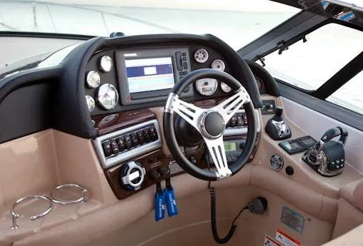  Yacht Photos Pics Manufacturer Provided Image: 2013 Four Winns Vista 375 boat cockpit with steering wheel and control panel.