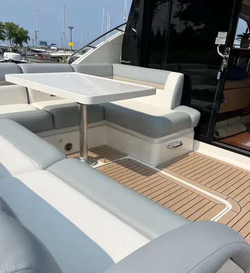 Party Of 5 Yacht Photos Pics 2014 Sea Ray 510 Sundancer yacht with elegant outdoor seating and table on teak deck.