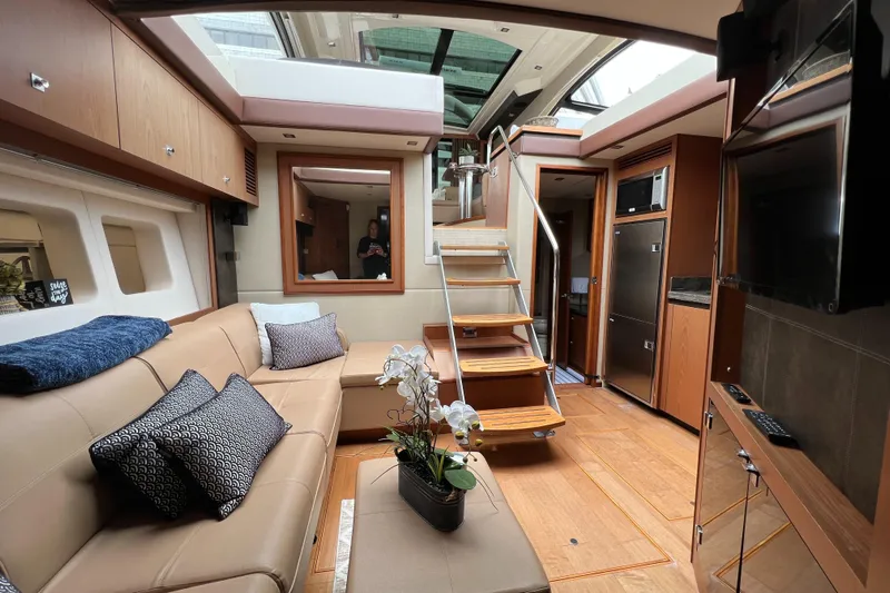 Party Of 5 Yacht Photos Pics Luxurious interior of 2014 Sea Ray 510 Sundancer yacht with modern furnishings and elegant design.