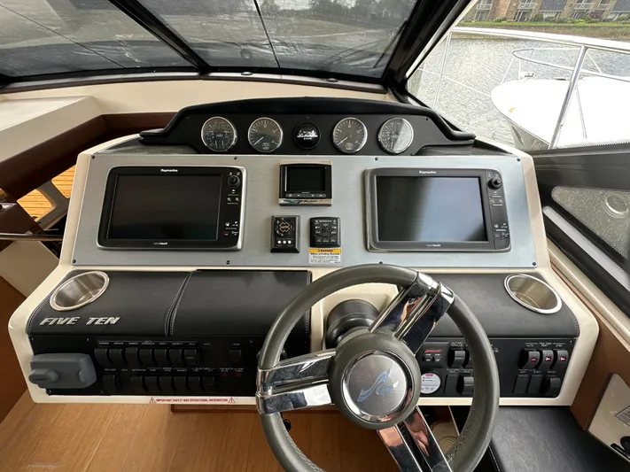 Party Of 5 Yacht Photos Pics Helm of 2014 Sea Ray 510 Sundancer with dual displays and steering wheel.