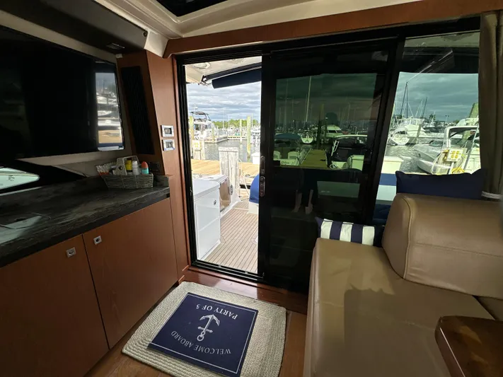 Party Of 5 Yacht Photos Pics Interior view of 2014 Sea Ray 510 Sundancer yacht with sliding glass door to deck.