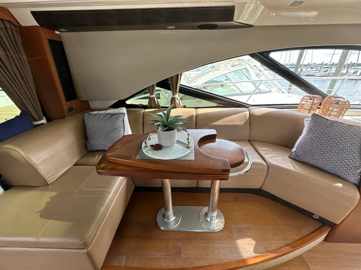 Party Of 5 Yacht Photos Pics Luxurious interior of 2014 Sea Ray 510 Sundancer yacht with elegant seating and table.