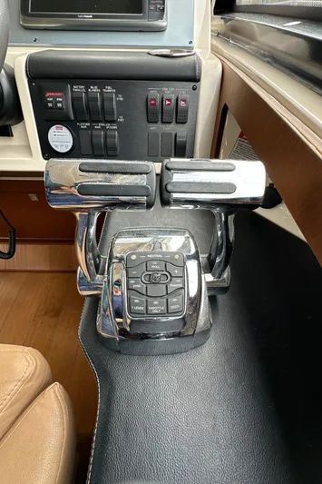 Party Of 5 Yacht Photos Pics Control panel of a 2014 Sea Ray 510 Sundancer yacht, featuring throttle levers and switches.