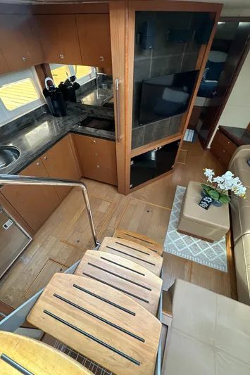 Party Of 5 Yacht Photos Pics Interior of 2014 Sea Ray 510 Sundancer yacht with modern kitchen and cozy seating area.