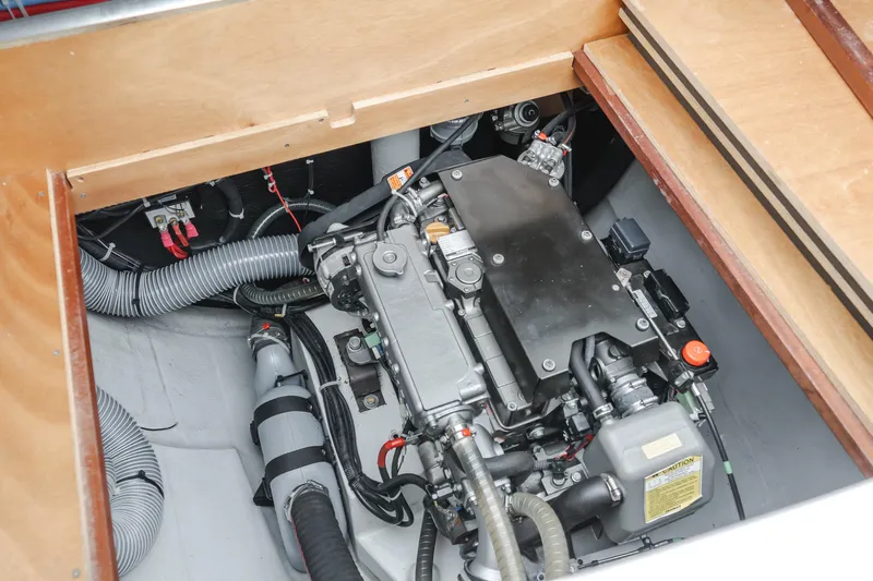 Limoncello Yacht Photos Pics Engine compartment of a 2016 Lagoon 450F catamaran, showcasing mechanical components and wiring.