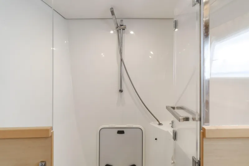 Limoncello Yacht Photos Pics Modern shower area in 2016 Lagoon 450F yacht, featuring sleek design and glass door.
