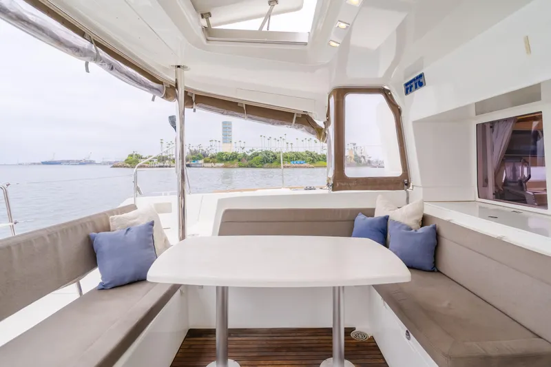 Limoncello Yacht Photos Pics Interior of 2016 Lagoon 450F catamaran with seating area and ocean view.