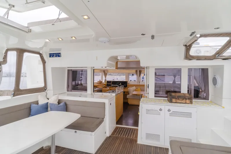 Limoncello Yacht Photos Pics Interior of 2016 Lagoon 450F catamaran, featuring modern seating and dining area.