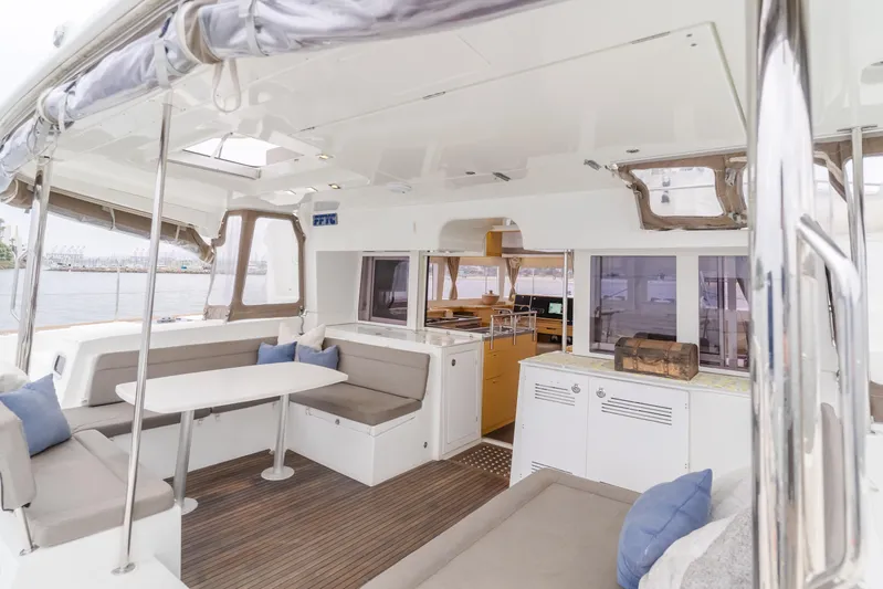 Limoncello Yacht Photos Pics Spacious interior of 2016 Lagoon 450F catamaran with seating and dining area.