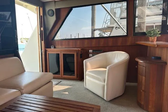 Arete Yacht Photos Pics Interior of 1988 Viking 45 Convertible yacht with modern seating and wooden accents.