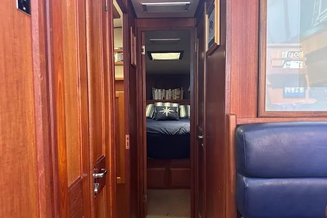 Arete Yacht Photos Pics Interior view of 1988 Viking 45 Convertible yacht with wooden paneling and cozy cabin.