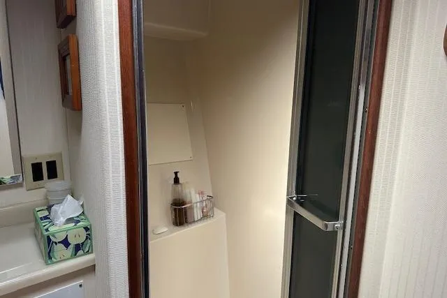 Arete Yacht Photos Pics 1988 Viking 45 Convertible yacht bathroom with shower and sink area.