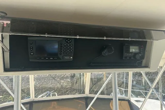 Arete Yacht Photos Pics 1988 Viking 45 Convertible boat dashboard with navigation and communication equipment.
