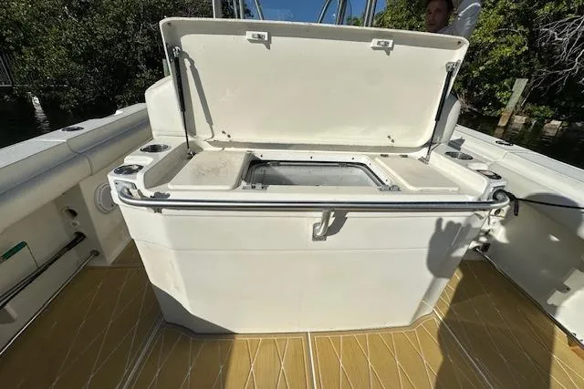  Yacht Photos Pics 2007 Hydra-Sports Vector 3300 CC boat with open storage compartment on deck.