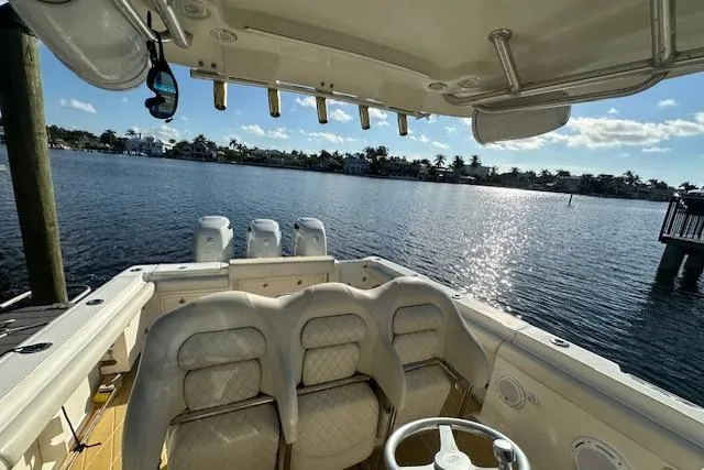  Yacht Photos Pics 2007 Hydra-Sports Vector 3300 CC boat interior with seating, overlooking a scenic waterfront.