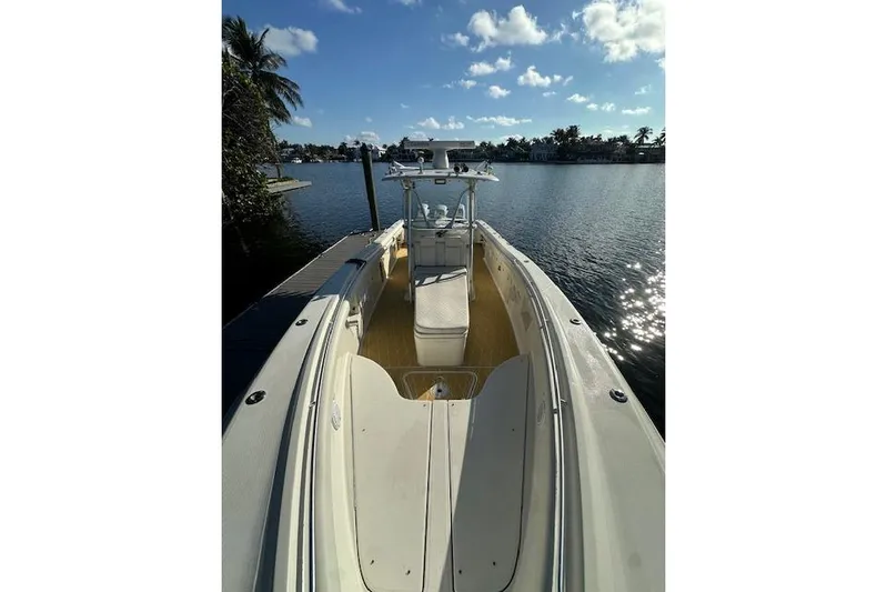  Yacht Photos Pics 2007 Hydra-Sports Vector 3300 CC boat docked by a scenic waterfront.