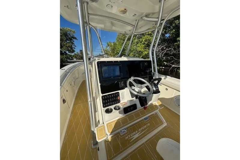  Yacht Photos Pics 2007 Hydra-Sports Vector 3300 CC boat console with steering wheel and navigation system.