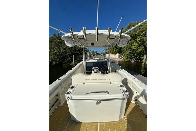  Yacht Photos Pics 2007 Hydra-Sports Vector 3300 CC boat interior with console and seating, surrounded by water and trees.