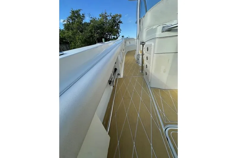  Yacht Photos Pics 2007 Hydra-Sports Vector 3300 CC boat deck with storage compartments and sleek design.