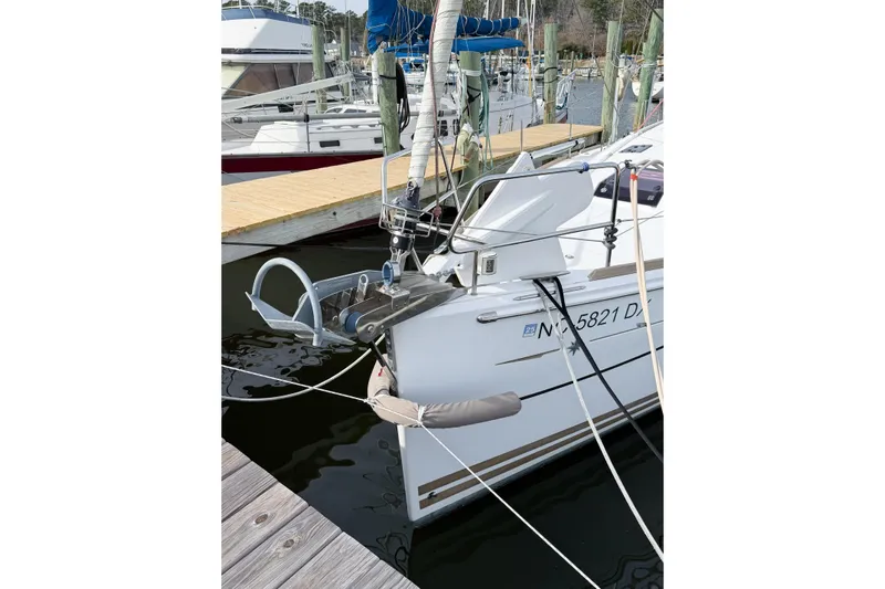 Take Five Yacht Photos Pics 2013 Jeanneau Sun Odyssey 409 sailboat docked at marina, showing anchor and bow details.