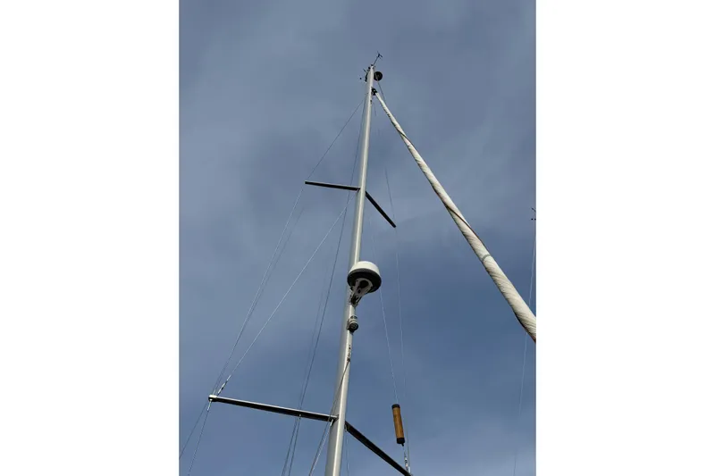 Take Five Yacht Photos Pics Mast of 2013 Jeanneau Sun Odyssey 409 sailboat against a clear sky.