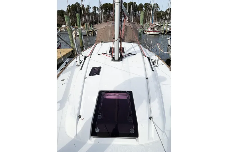Take Five Yacht Photos Pics 2013 Jeanneau Sun Odyssey 409 sailboat deck with marina background.