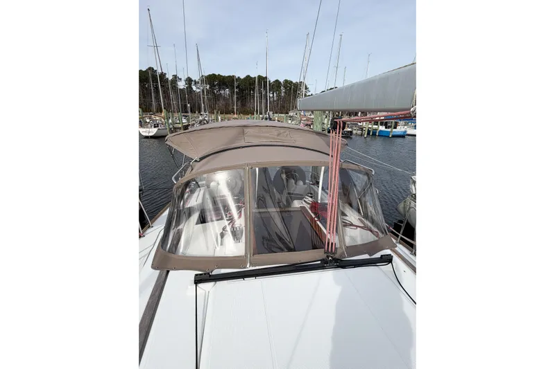 Take Five Yacht Photos Pics 2013 Jeanneau Sun Odyssey 409 sailboat docked at marina, featuring a covered cockpit.