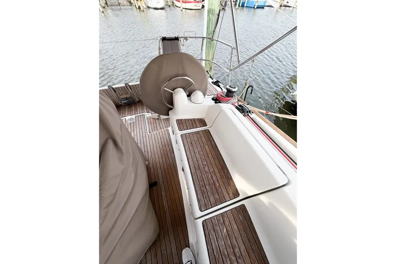Take Five Yacht Photos Pics 2013 Jeanneau Sun Odyssey 409 cockpit with wooden flooring and steering wheel.