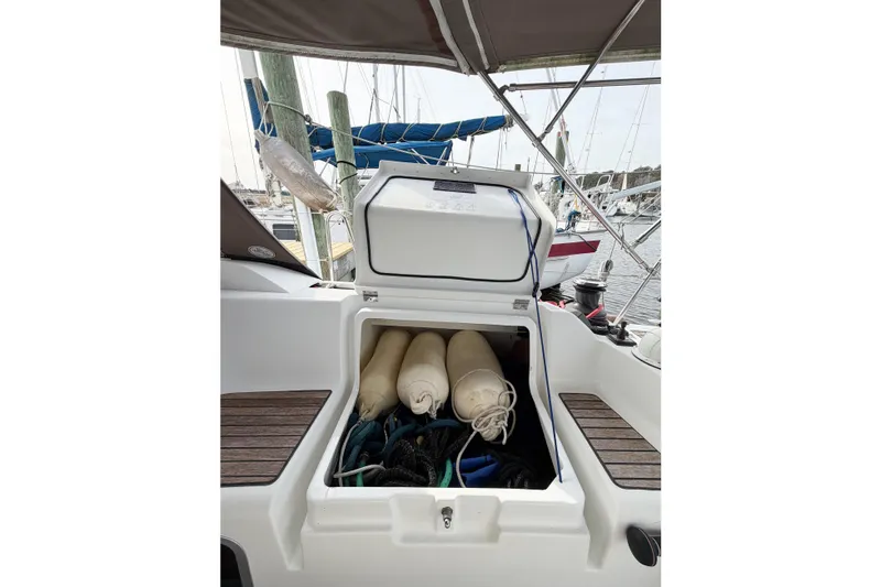 Take Five Yacht Photos Pics Storage compartment on 2013 Jeanneau Sun Odyssey 409 sailboat, containing fenders and ropes.