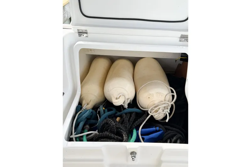 Take Five Yacht Photos Pics Storage compartment on 2013 Jeanneau Sun Odyssey 409 with fenders and ropes.