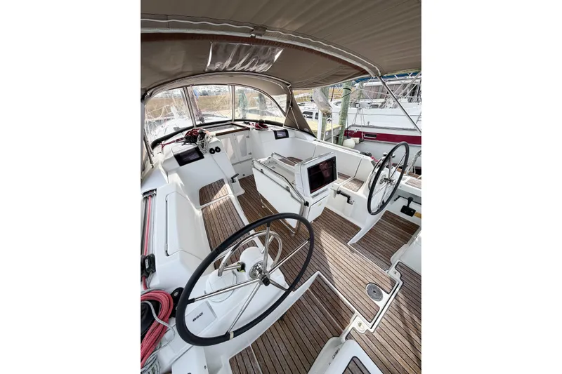 Take Five Yacht Photos Pics 2013 Jeanneau Sun Odyssey 409 yacht cockpit with dual steering wheels and teak flooring.