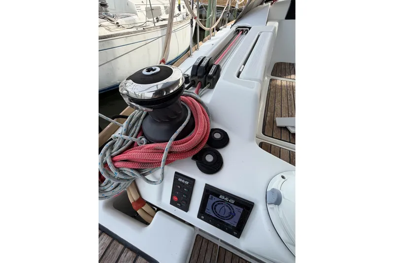 Take Five Yacht Photos Pics Jeanneau Sun Odyssey 409 sailboat deck with winch, ropes, and navigation display, 2013 model.