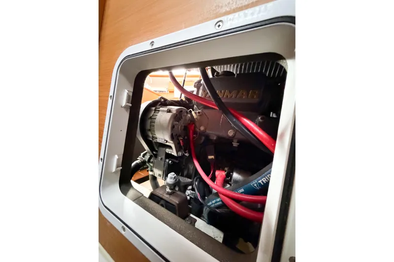 Take Five Yacht Photos Pics Engine compartment of 2013 Jeanneau Sun Odyssey 409 sailboat, featuring Yanmar engine components.