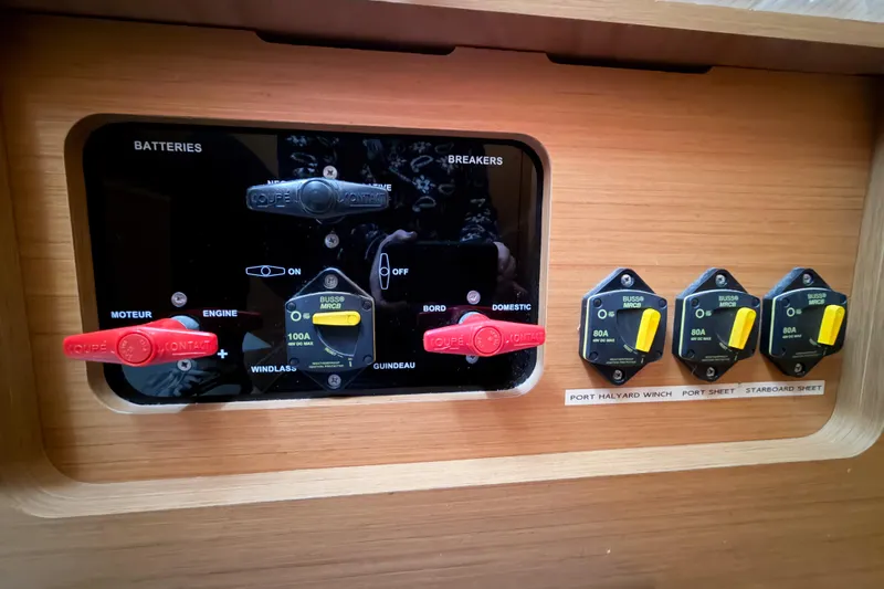 Take Five Yacht Photos Pics Electrical panel of 2013 Jeanneau Sun Odyssey 409 sailboat with labeled switches and breakers.