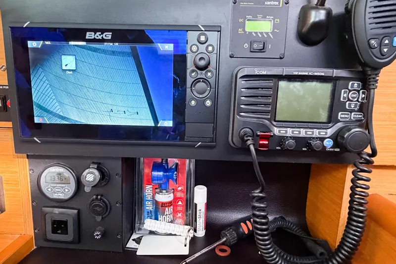 Take Five Yacht Photos Pics Control panel of 2013 Jeanneau Sun Odyssey 409 with navigation and communication equipment.