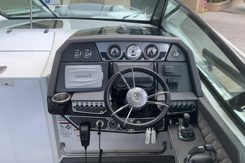  Yacht Photos Pics 2015 Cruisers Sport Series 328 BR boat dashboard with Garmin navigation system.