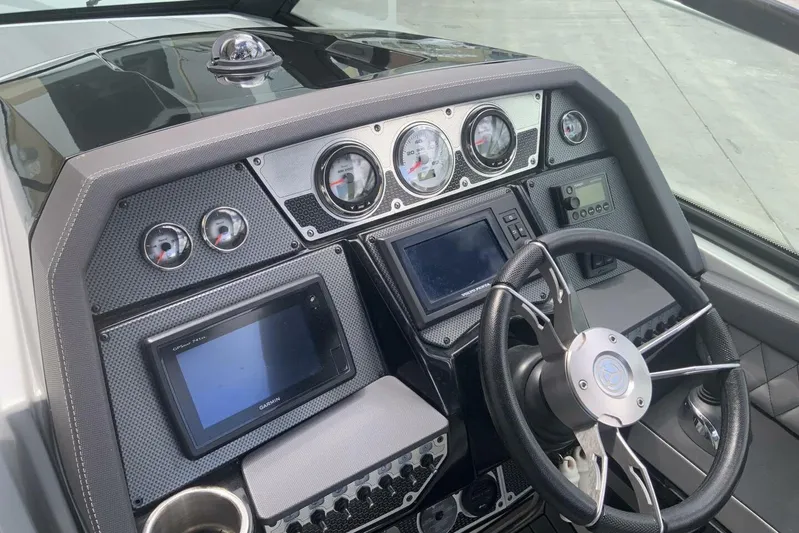  Yacht Photos Pics Dashboard of 2015 Cruisers Sport Series 328 BR boat with steering wheel and gauges.