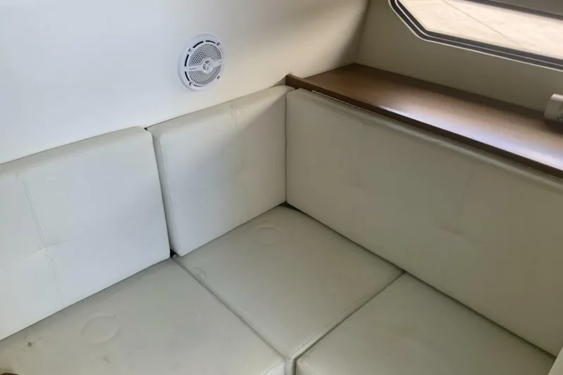  Yacht Photos Pics 2015 Cruisers Sport Series 328 BR interior with white seating and speaker.