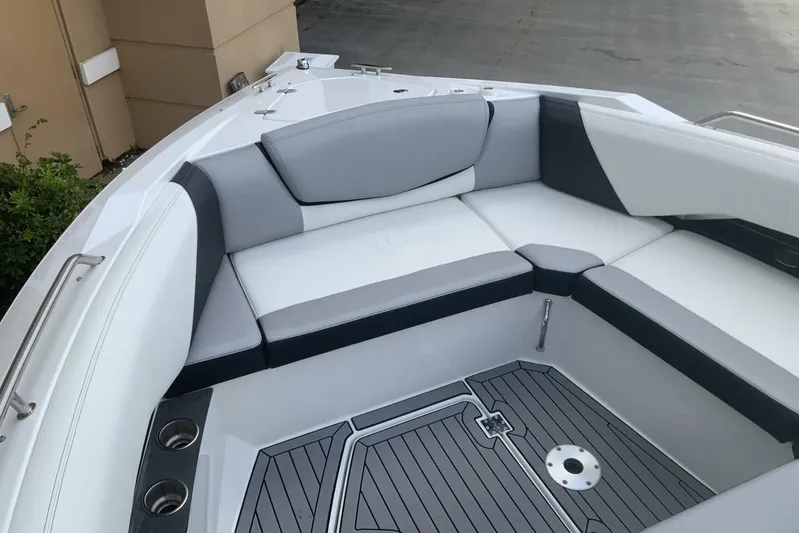  Yacht Photos Pics 2015 Cruisers Sport Series 328 BR boat interior with cushioned seating and cup holders.