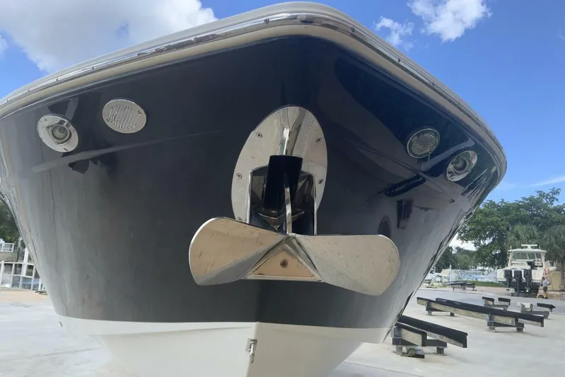  Yacht Photos Pics 2015 Cruisers Sport Series 328 BR boat bow with anchor, docked under blue sky.