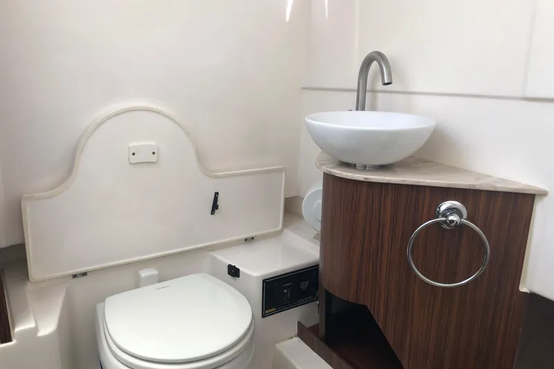  Yacht Photos Pics 2018 Pursuit S 328 Sport boat bathroom with modern sink and toilet.