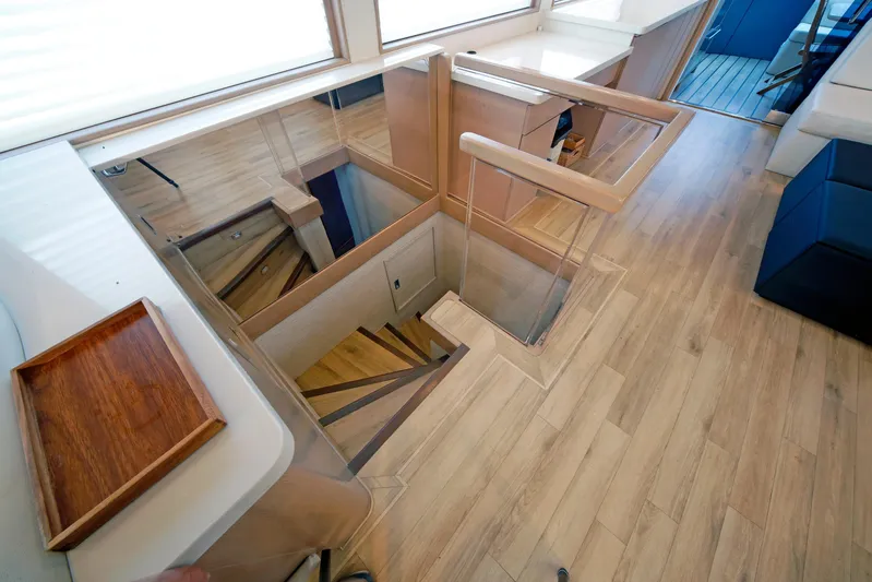 Final Kiwi Yacht Photos Pics Interior of 1995 Hatteras 74 Cockpit Motor Yacht with wooden stairs and modern design.