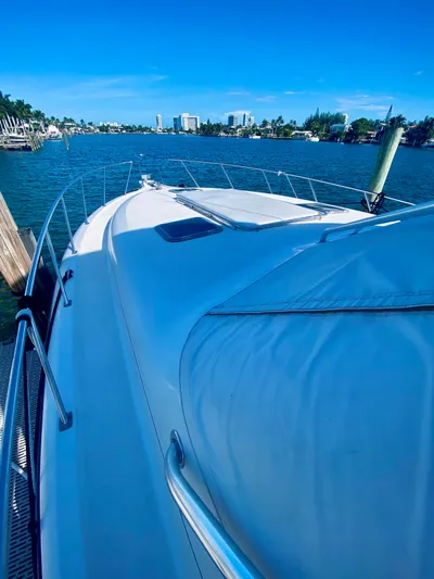  Yacht Photos Pics 1999 Tiara Yachts 43 Open on calm water, clear sky, coastal view.