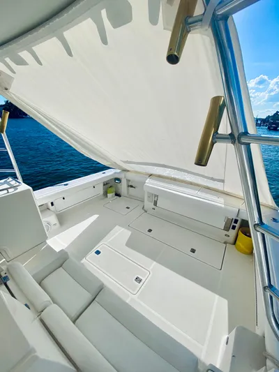  Yacht Photos Pics 1999 Tiara Yachts 43 Open with spacious deck and canopy, overlooking serene waters.