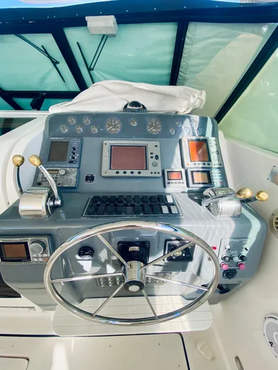  Yacht Photos Pics 1999 Tiara Yachts 43 Open helm with advanced navigation controls and steering wheel.