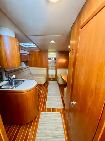  Yacht Photos Pics Interior of 1999 Tiara Yachts 43 Open with wood finish and modern amenities.